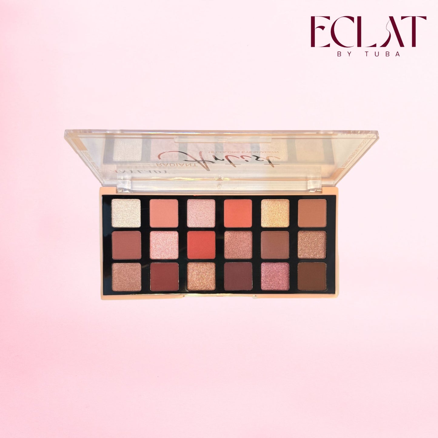 ECLAT BY TUBA eyeshadow palette with 16 shades in a square compact, shown open against a soft pink background with the brand logo in the top right corner.