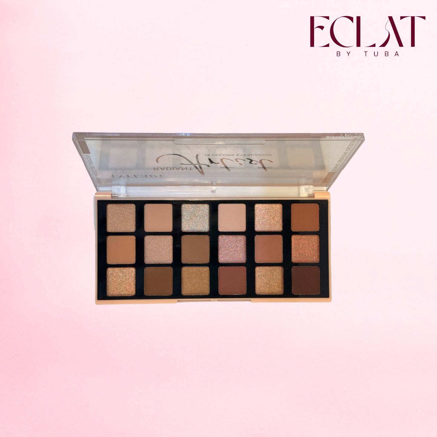 An open eyeshadow palette with 16 square pans in neutral shades, shown against a soft pink gradient background. The brand name 'ECLAT BY TUBA' is visible in the top right corner.